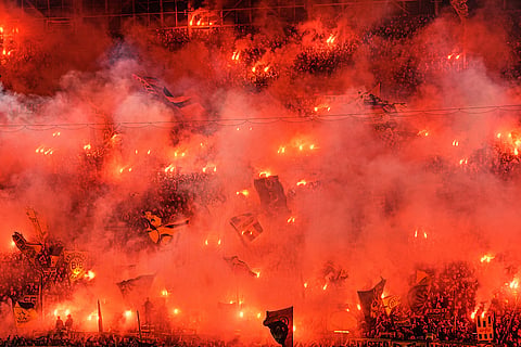 Dortmund's fans light up flares during the German soccer cup match between Borussia Dortmund and Werder Bremen in Dortmund, Germany, Tuesday, Oct. 27, 2026.