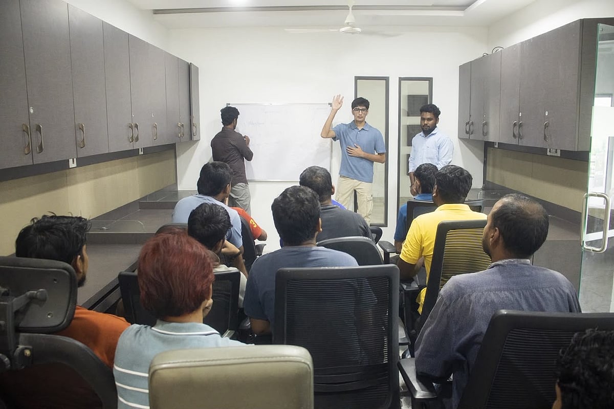 People attending a training session in a meeting room.
