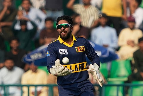 Sri Lanka's Kusal Mendis celebrates after he takes a catch to dismiss Pakistan's Arafat Minhas during the tri-series one-day international cricket match between Pakistan and Sril Lanka, in Lahore, Pakistan, Tuesday, Oct. 27, 2026. 
