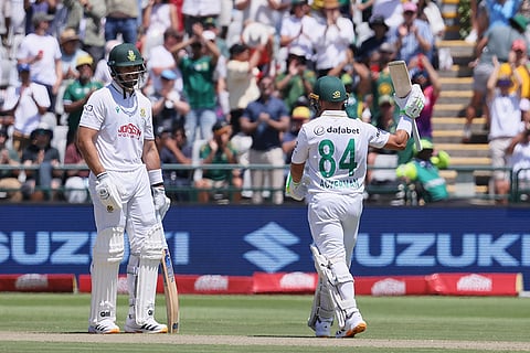 South Africa's Marques Ackerman, right, celebrates his fifty as teammate Aiden Markram watches on during day one of the third cricket test match between South Africa and Australia in Cape Town, South Africa, Tuesday, Oct. 27, 2026.