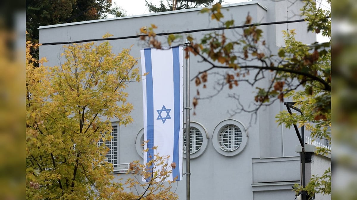 An Israeli flag is seen outside the Embassy of Israel after an unidentified assailant attacked a guard with knives in Belgrade - AP Photo/Armin Durgut