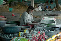 In Pictures | Firecracker Makers Prepare For The Diwali Rush | Photo: AP/Ajit Solanki : A worker makes firecrackers for the upcoming Hindu festival of Diwali at a factory on the outskirts of Ahmedabad, Tuesday, Oct. 27, 2026.