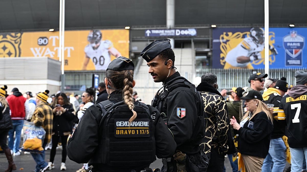 Police officers patrol outside the Stade de France stadium before the start of the NFL football game between Pittsburgh Steelers and New Orleans Saints in Saint-Denis, outside Paris, Sunday, Oct. 25, 2026. - (AP Photo/Emma Da Silva)