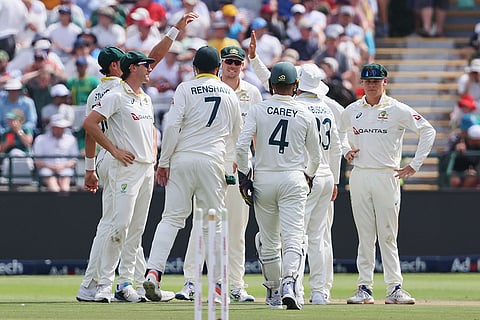 Australian players celebrate the wicket of South Africa's captain Temba Bavuma on day one of the third cricket test match between South Africa and Australia in Cape Town, South Africa, Tuesday, Oct. 27, 2026.