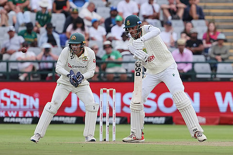 South Africa's Marco Jansen, right, plays a shot as Australia's wicketkeeper Alex Carey watches on during day one of the third cricket test match between South Africa and Australia in Cape Town, South Africa, Tuesday, Oct. 27, 2026.