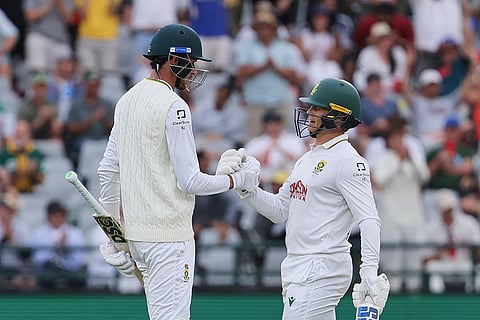 South Africa's Marco Jansen, left, celebrates his fifty with teammate Ryan Rickelton on day one of the third cricket test match between South Africa and Australia in Cape Town, South Africa, Tuesday, Oct. 27, 2026.