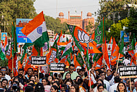In Photos: Nitin Nabin Leads BJP's 'Loktantra Bachao, Arajakta Hatao' March | Photo: PTI/Salman Ali : BJP leaders, workers, and supporters carry national flags and party banners with the Red Fort in the background during the 'Loktantra Bachao, Arajakta Hatao' protest march, at Chandni Chowk, in New Delhi, Wednesday, Oct. 28, 2026. The march commenced from Shri Jain Lal Mandir near the Red Fort and concluded at Town Hall Chowk as part of a nationwide counter-campaign.