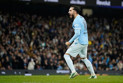 Manchester City's Rayan Cherki celebrates after scoring during penalty shootout during the English League Cup soccer match between Manchester City and Brighton and Hove Albion in Manchester, England, Wednesday, Oct. 28, 2026. 