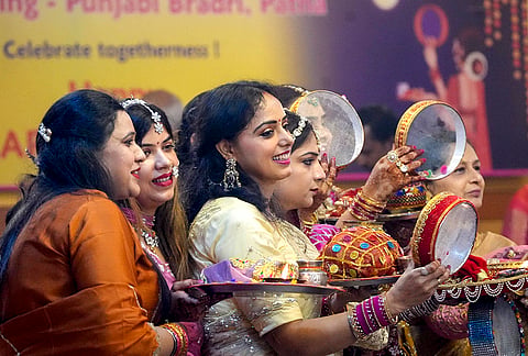 Women pose for photographs on 'Karva Chauth' festival, in Patna, Bihar, Thursday, Oct. 29, 2026. 
