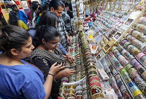 Women shop for bangles ahead of the ‘Karva Chauth’ festival, in Jammu, Sunday, Oct. 25, 2026. 