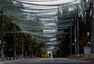 | Photo: AP/Evgeniy Maloletka : A woman walks beneath anti-drone nets stretched over a street during a local ceasefire related to a humanitarian aid mission in Oleshky, in Kherson, Ukraine, Wednesday, Oct. 28, 2026. 