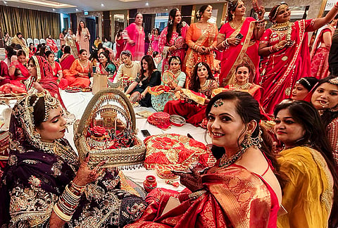 Married women perform a ritual on 'Karva Chauth' festival, in Indore, Madhya Pradesh, Thursday, Oct. 29, 2026. 
