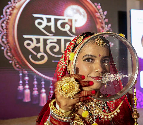 A woman performs rituals during the ‘Karwa Chauth’ festival, in Bhopal, Thursday, Oct. 29, 2026. 
