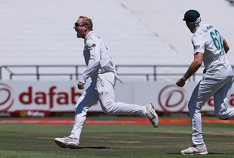 South Africa's Simon Harmer celebrates with teammates the wicket of Australia's Marnus Labuschagne, on day two of the third cricket test match between South Africa and Australia, in Cape Town, South Africa, Wednesday, Oct. 28, 2026. 