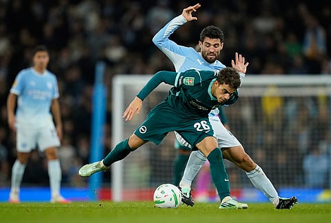 Brighton's Yasin Ayari challenges for the ball with Manchester City's Mateo Kovacic, rear, during the English League Cup soccer match between Manchester City and Brighton and Hove Albion in Manchester, England, Wednesday, Oct. 28, 2026. 