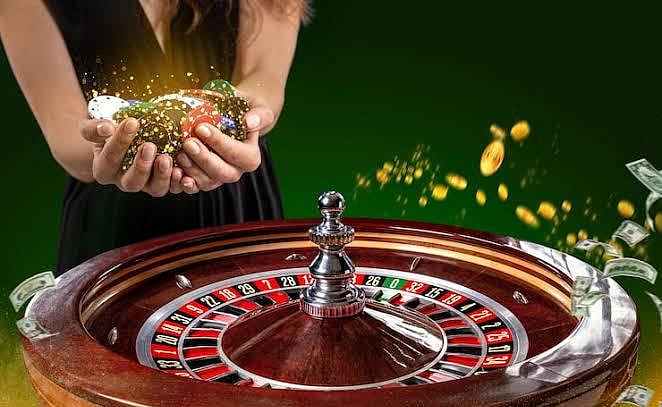Woman holding glowing chips behind roulette wheel