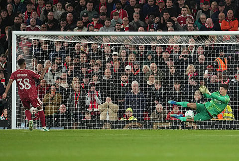 Chelsea's goalkeeper Mike Penders saves shot by Liverpool's Ryan Gravenberch during penalty shootout during the fourth-round English Football League Cup soccer match between Liverpool and Chelsea in Liverpool, England, Wednesday, Oct. 28, 2026. 