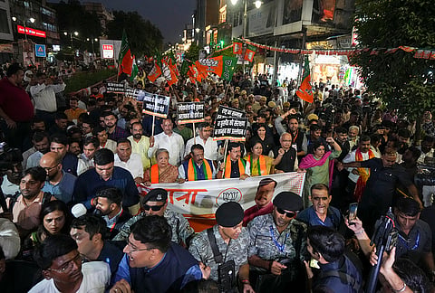 Delhi Chief Minister Rekha Gupta, along with BJP National President Nitin Nabin, Delhi BJP President Harsh Malhotra, and others, leads party workers during the 'Loktantra Bachao, Arajakta Hatao' march from Gauri Shankar Temple to Town Hall Chowk in Chandni Chowk, in New Delhi, Wednesday, Oct. 28, 2026. 
