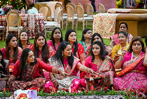 Delhi Chief Minister Rekha Gupta along with other married women perform a ritual as they celebrate 'Karva Chauth' festival, at Jan Seva Sadan, in New Delhi, Thursday, Oct. 29, 2026. 
