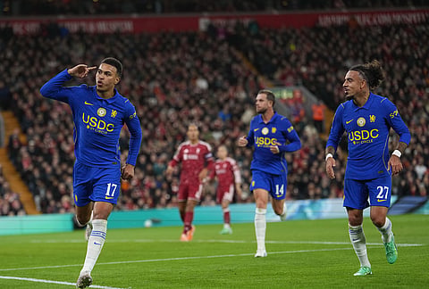 Chelsea's Morgan Rogers, left, celebrates after scoring first goal during the fourth-round English Football League Cup soccer match between Liverpool and Chelsea in Liverpool, England, Wednesday, Oct. 28, 2026. 