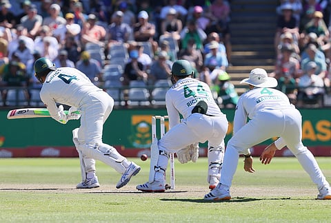 Australia's Alex Carey, left, South Africa's Ryan Rickelton, and South Africa's Aiden Markram, in action during the day two of the third cricket test match between South Africa and Australia, in Cape Town, South Africa, Wednesday, Oct. 28, 2026. 
