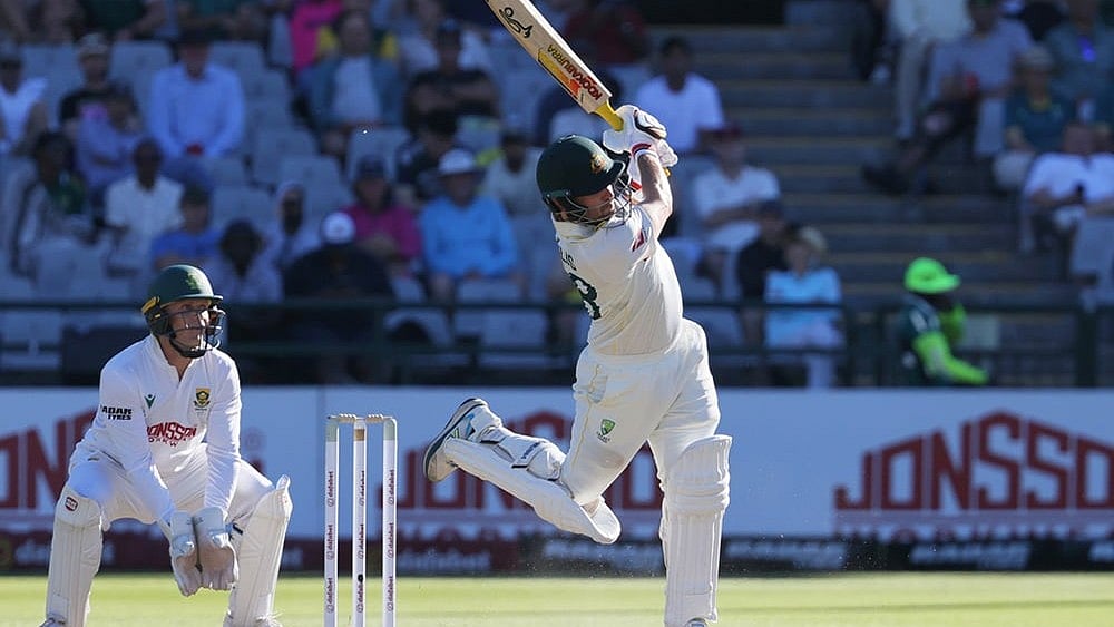 Australia's Josh Inglis plays a shot as South Africa's wicketkeeper Ryan Rickelton watches on day two of the third cricket test match between South Africa and Australia, in Cape Town, South Africa, Wednesday, Oct. 28, 2026. - | Photo: AP/Halden Krog