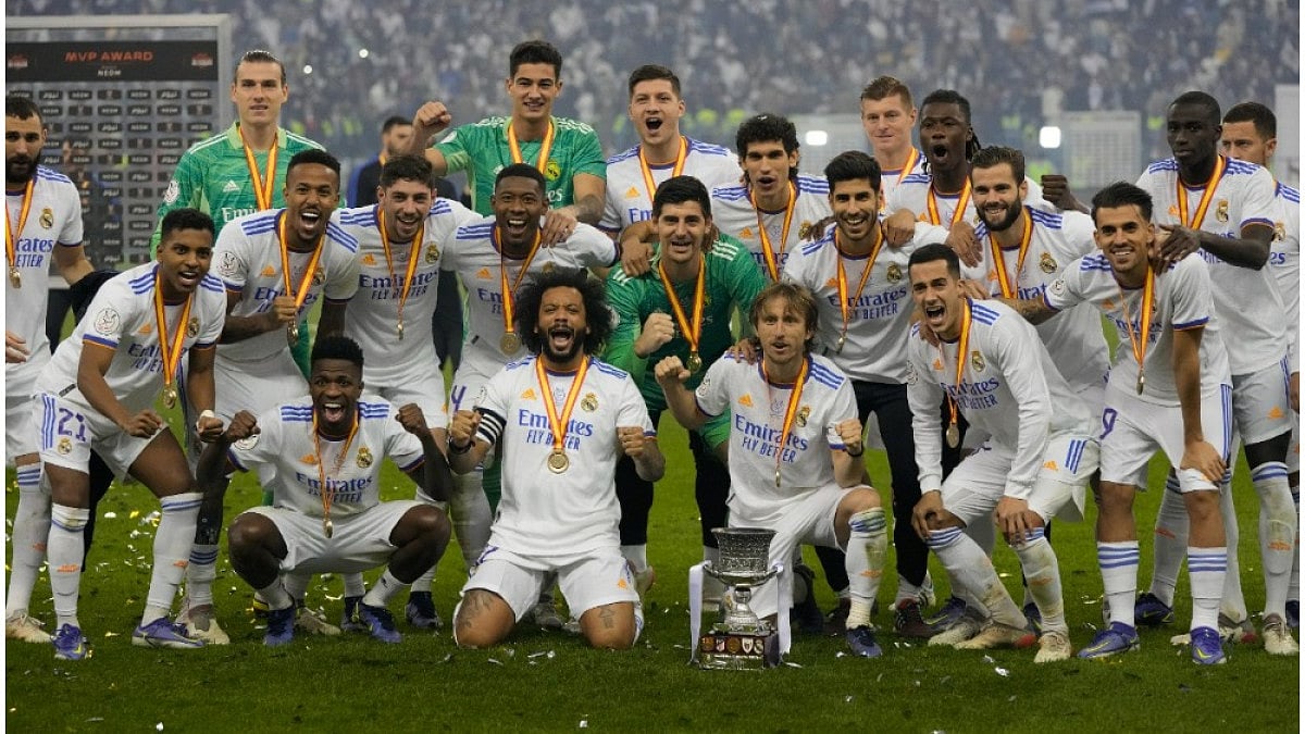 Real Madrid's players celebrate after winning the Spanish Super Cup 2021-22 on Sunday.