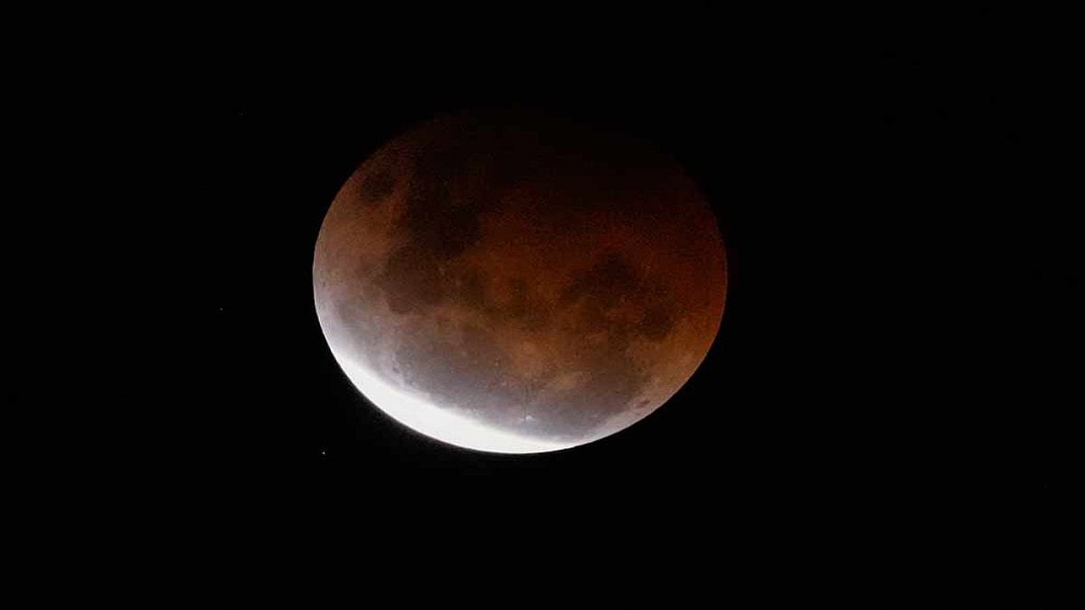 Super Blood Moon Dazzles In Reddish-Orange