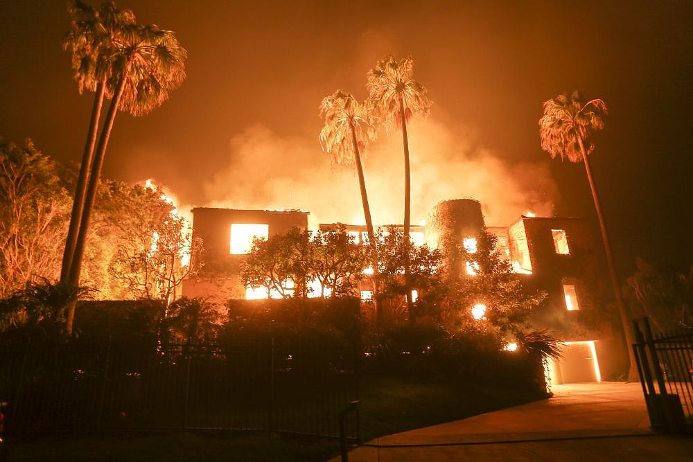 File photo : Firefighters and defense helicopters sprayed water but the blazes in the two prefectures had not been extinguished as of Monday afternoon. (for representative purposes only)
