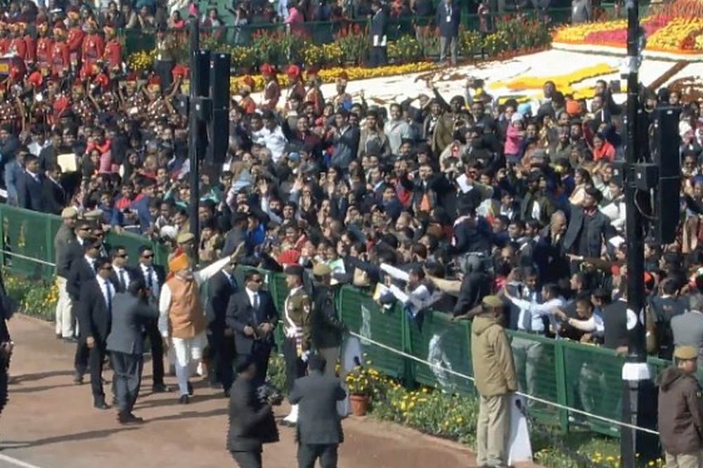 PM Modi greets people on Rajpath after the Republic Day Parade.