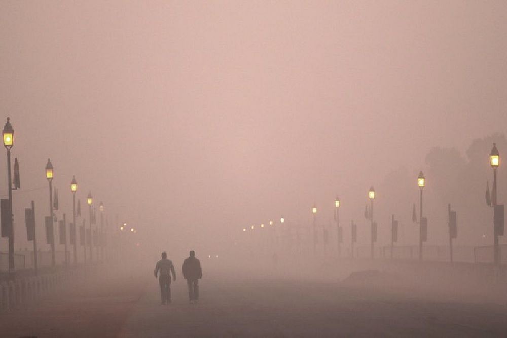 People take early morning walk amidst smog in New Delhi