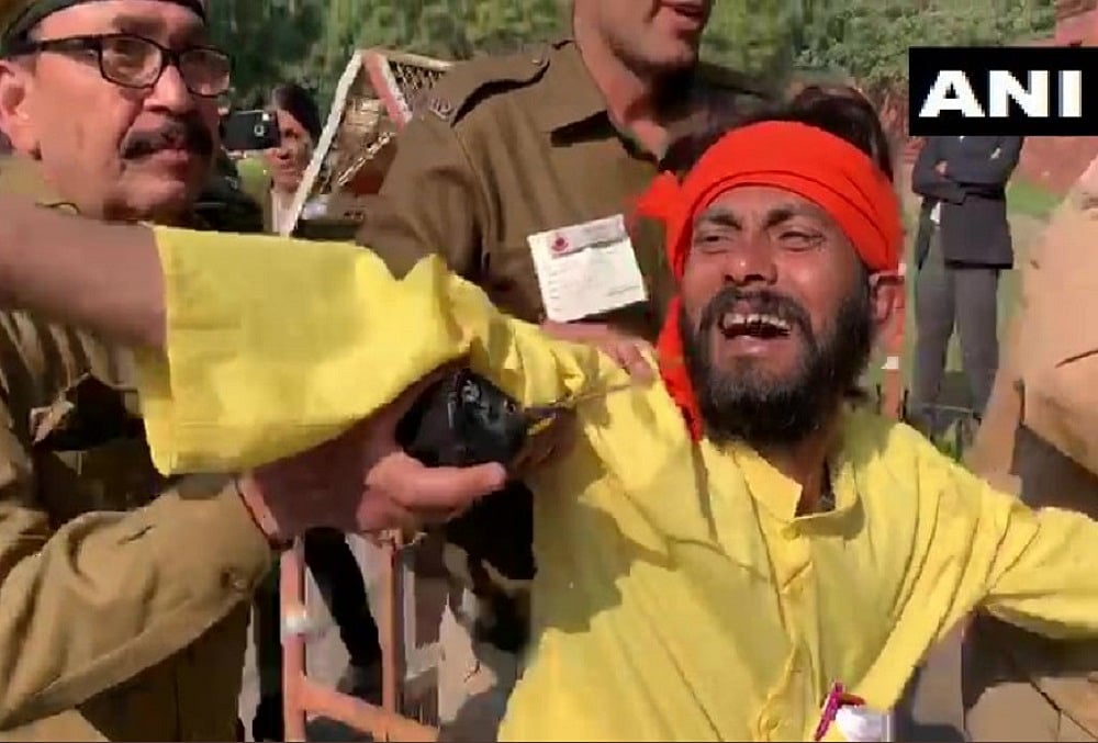 Man Lies Down In Front of Rajnath Singh's Convoy Demanding Change In Aadhaar Card