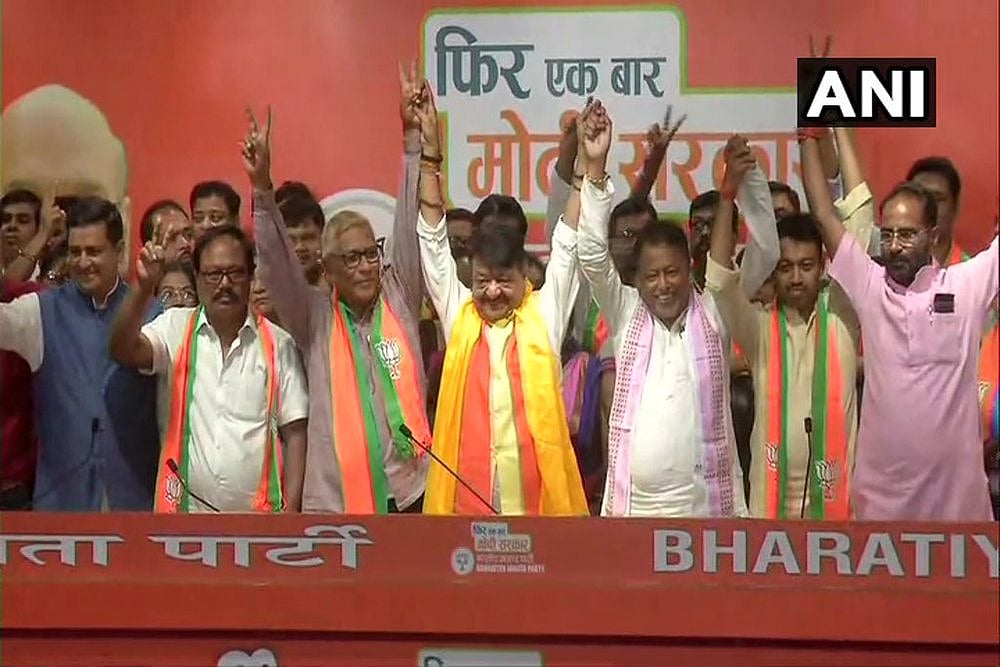 West Bengal BJP chief Kailash Vijayvargiya with MLAs and councillors who joined BJP on Tuesday. 