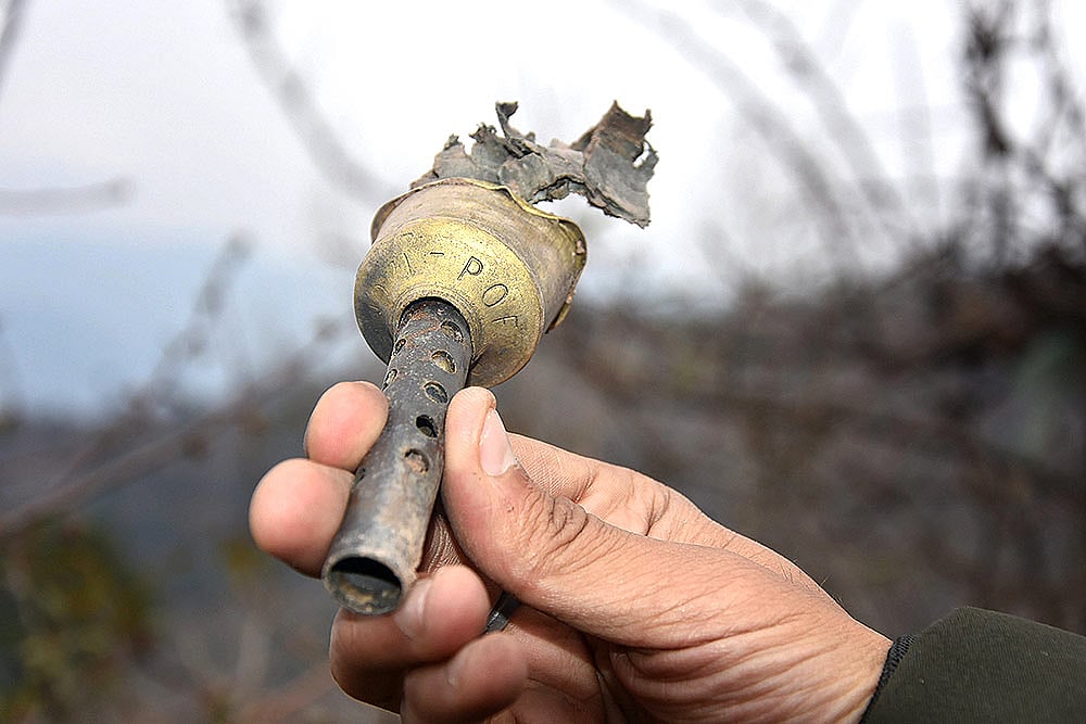 A villager shows a part of a mortar shell fired from the Pakistani side at Mendhar in Poonch district. (Image used for representational purpose only)