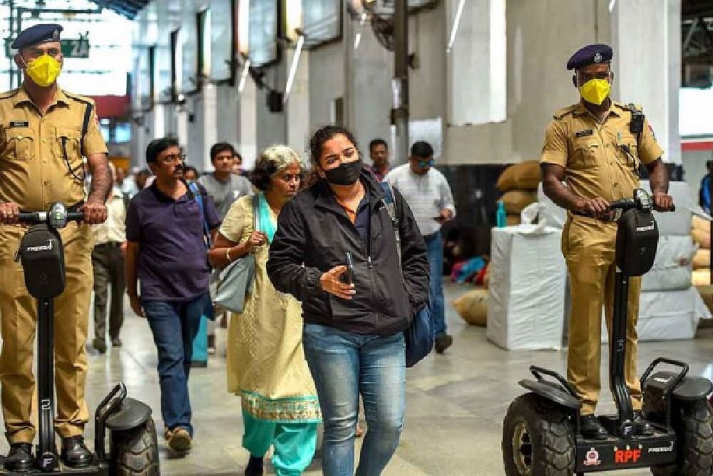 RPF personnel wear masks for precaution against novel coronavirus (COVID-19) at Central Railway Station, in Chennai.