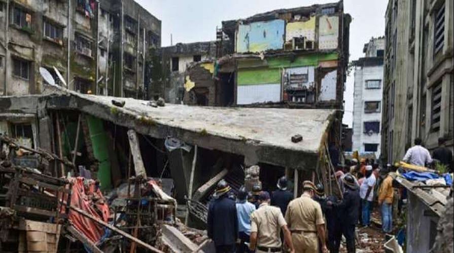 A flat's roof caved in, injuring three members of the family; about a hundred others were evacuated.
