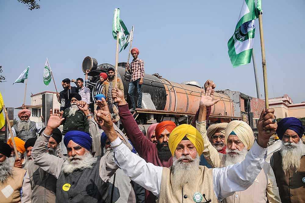 Farmers block a railway track during a four-hour rail roko demonstration across the country, called by Samyukta Kisan Morcha (SKM), as part of their agitation against Centres farm reform laws, at Rajpura in Patiala district.