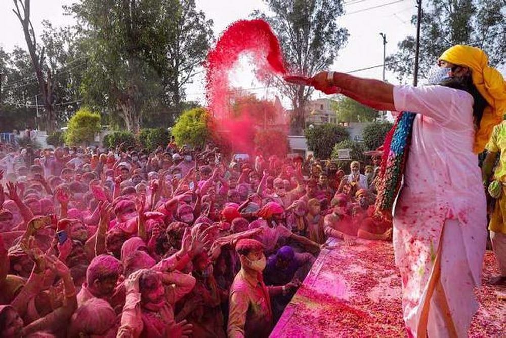 Devotees celebrate Holi festival, at Shri Priyakant Ju temple in Vrindavan.