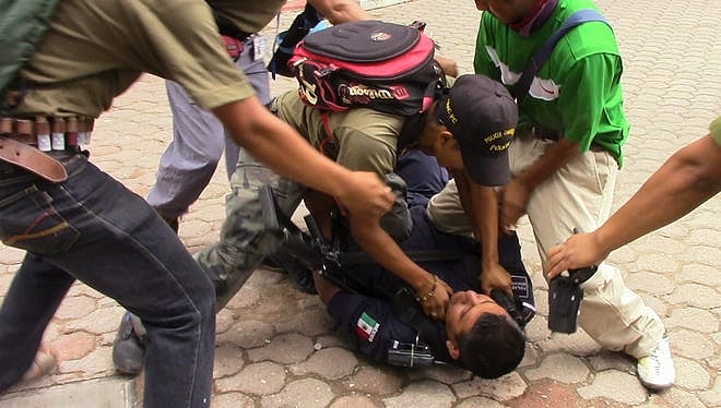 Vigilantes Raid Southern Mexico Town, Abduct 21, Burn Homes