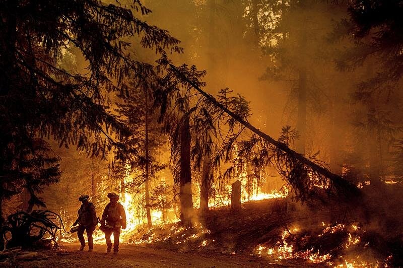 Western Wildfires Calm Down In Cool Weather, But Losses Continue To Grow