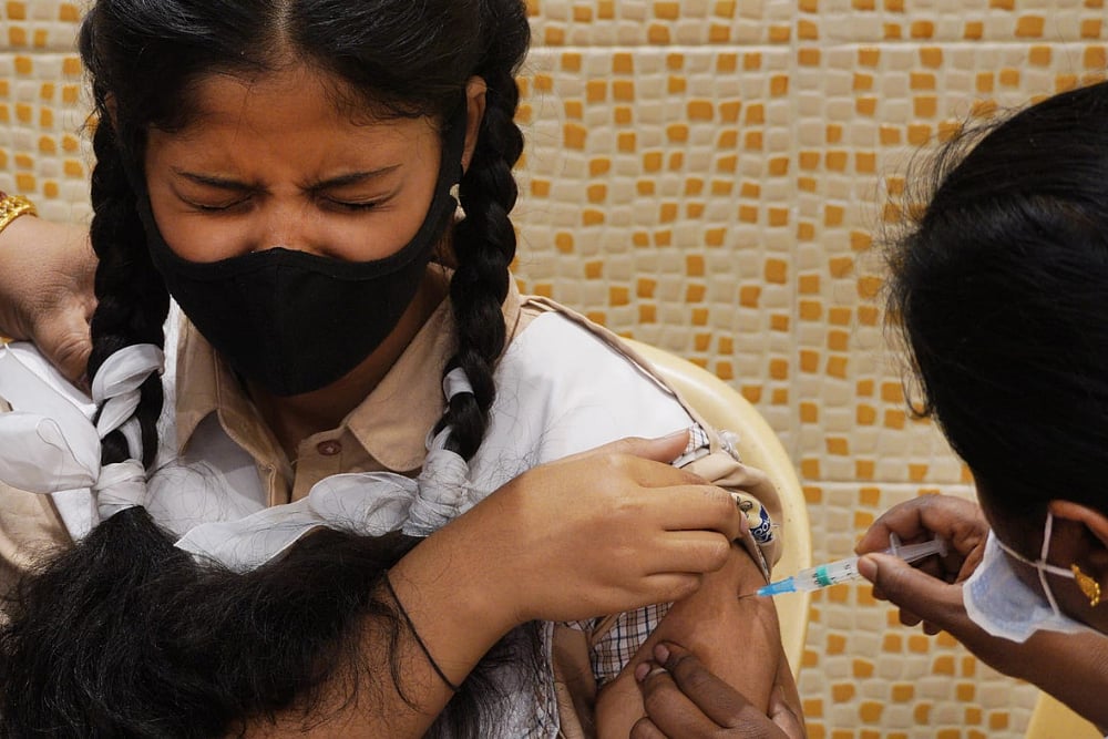 Omicron And Children: Is Vaccinating Adults Key To Keeping Kids Safe?