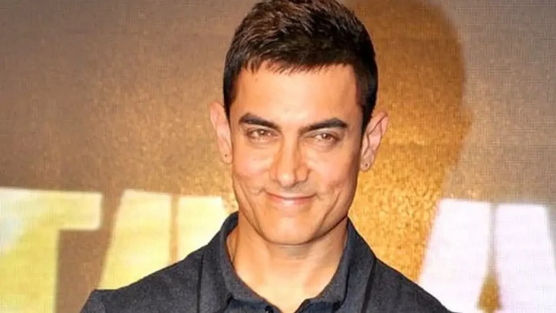 Aamir Khan Enjoys Playing Football With Son Azad Khan In The Rain