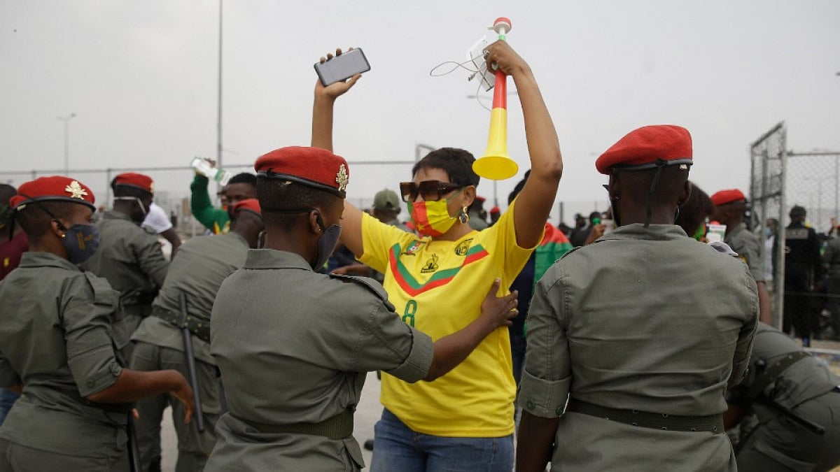 Gendarmerie search Cameroon football fans outside the stadium before the AFCON 2021 tie vs Gambia. 