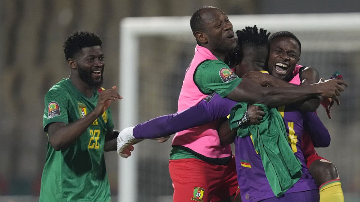 Cameroon's players celebrate after beating Burkina Faso.