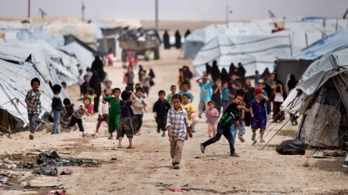 Children gather outside their tents, at al-Hol camp, which houses families of members of the Islamic State group, in Hasakeh province, Syria.