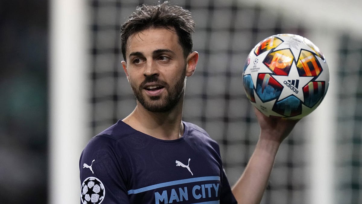 Manchester City's Bernardo Silva holds the ball during their match against Sporting CP.