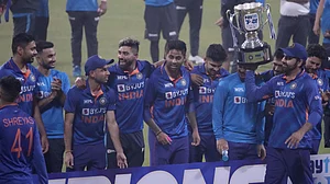 India captain Rohit Sharma holds the trophy after their T20 series win against West Indies.