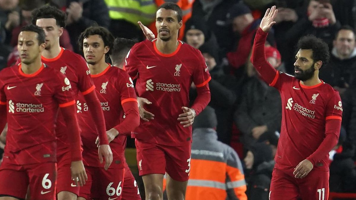 Liverpool's Mohamed Salah (R) celebrates after scoring second goal vs Leeds United in EPL game.