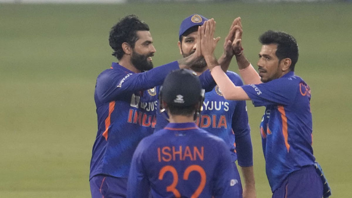 Indian cricketers celebrate the dismissal of Sri Lanka's Dinesh Chandimal.