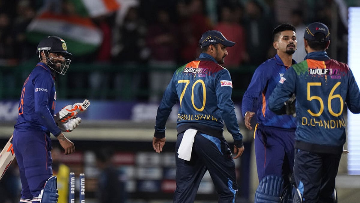 India's Ravindra Jadeja, left, Shreyas Iyer, second right, with Sri Lankan players.